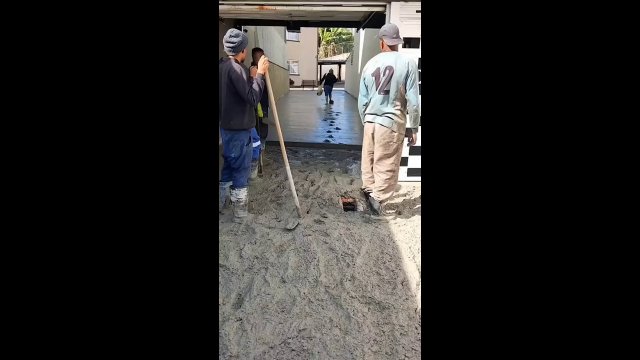 Lady decides to walk through wet cement [WIDEO]