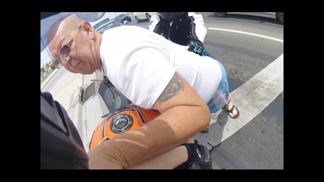 Road rage against motoryclist turns physical