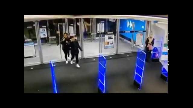 Shopper pushes open store's glass doors so hard that they smash to smithereens