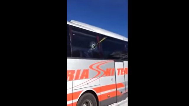 A ski sails through the air and crashes through a bus window when a showoff skier messes up
