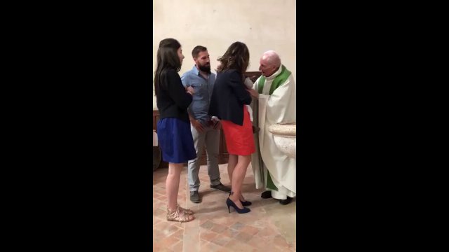 Priest slaps baby for crying during baptism [VIDEO]