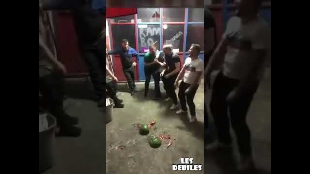 A man who hits the head of a watermelon instead of a ball