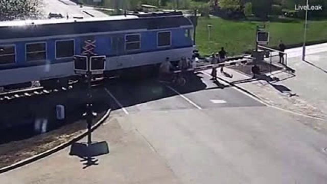 Heroic Bystander Saves Biker From Being Hit By Train