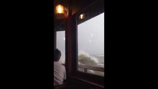 Wave Breaks Through Restaurant
