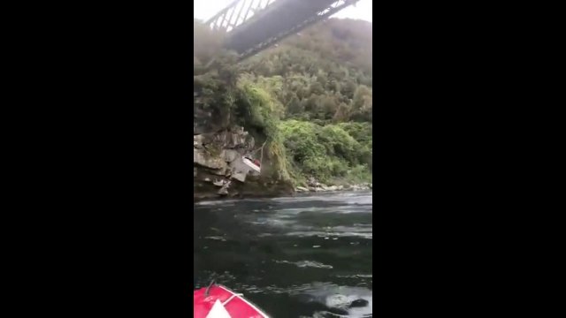 Jet boat swings from bridge