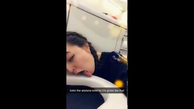 Girl licking airplane toilet seat