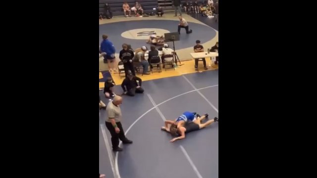 Dad tackles son's wrestling opponent [VIDEO]