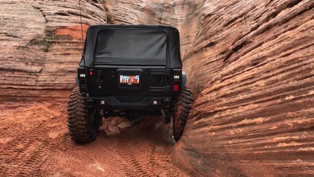 Jeep drives up a vertical wall!