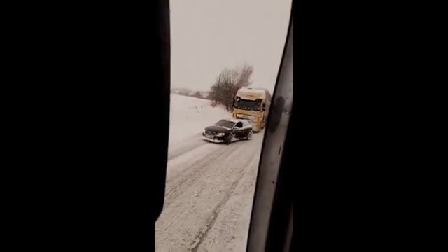 Audi pulls huge lorry up snow covered hill