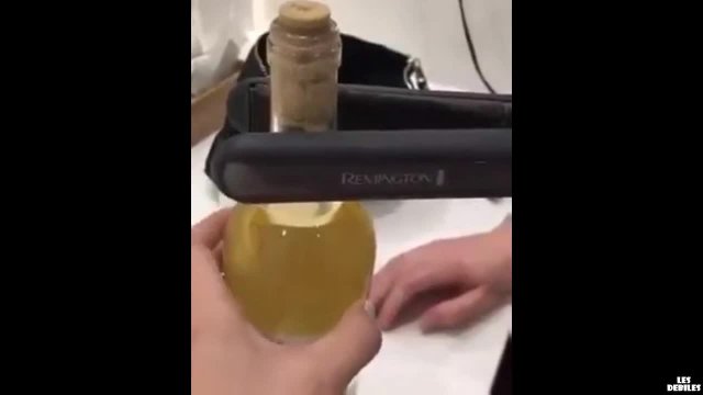 Woman uses hair straighteners to pop wine cork in hack