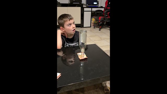 Boy Outsmarts Dad and Pulls Money Bill Kept Under Bottle Without Touching It [VIDEO]