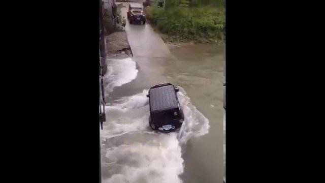 Extreme ride through a rushing river.