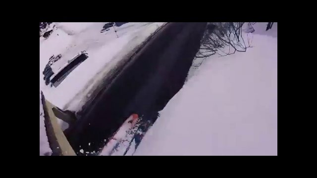 Skier falling off cliff into road