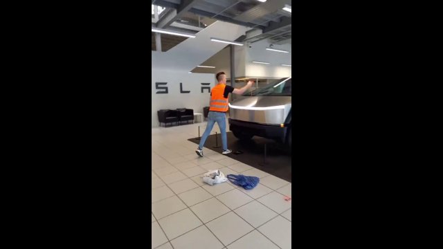 Climate protesters dump orange paint on a Tesla Cybertruck in Hamburg, Germany [VIDEO]